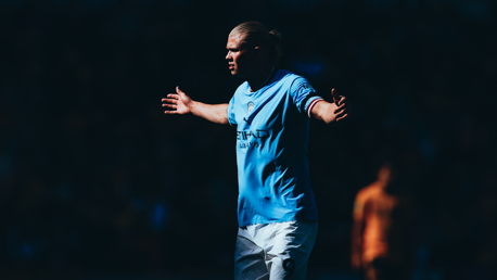 Erling Haaland runs towards the City fans