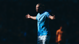 Erling Haaland runs towards the City fans