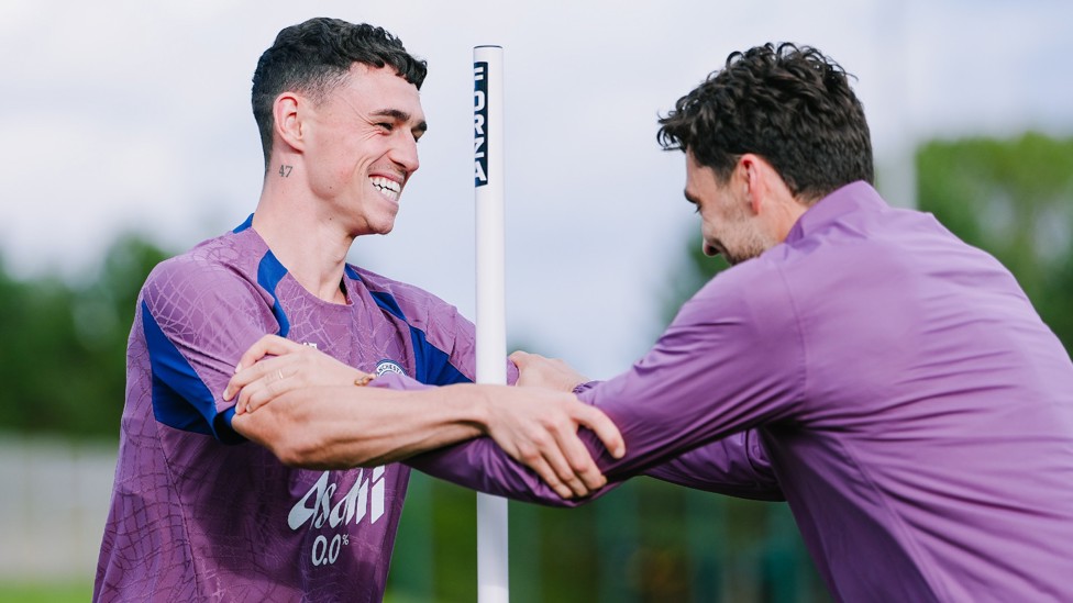 HAPPY CHAP : Phil Foden shares a smile during one of today's training drills