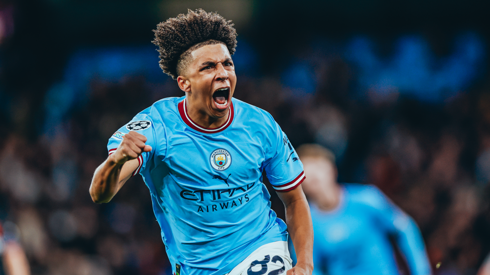 RECORD BREAKER : Lewis celebrates making it 1-1 and becoming our youngest ever Champions League goalscorer!