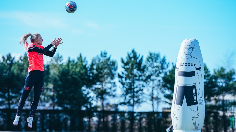 JUMPING HIGH : Alex Greenwood wins the ball with ease. 