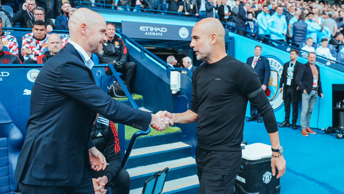 BOSSES: Guardiola and Ten Hag share a warm embrace ahead of kick-off.