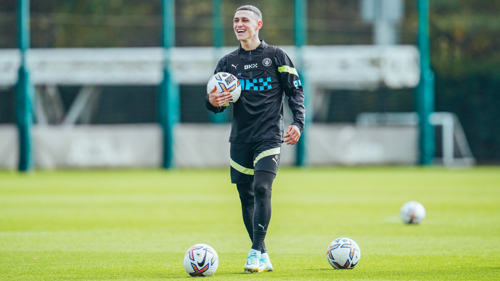 FAMILIAR FEELING : Phil Foden holds a match ball similar to the one he took home after his hattrick against Manchester United