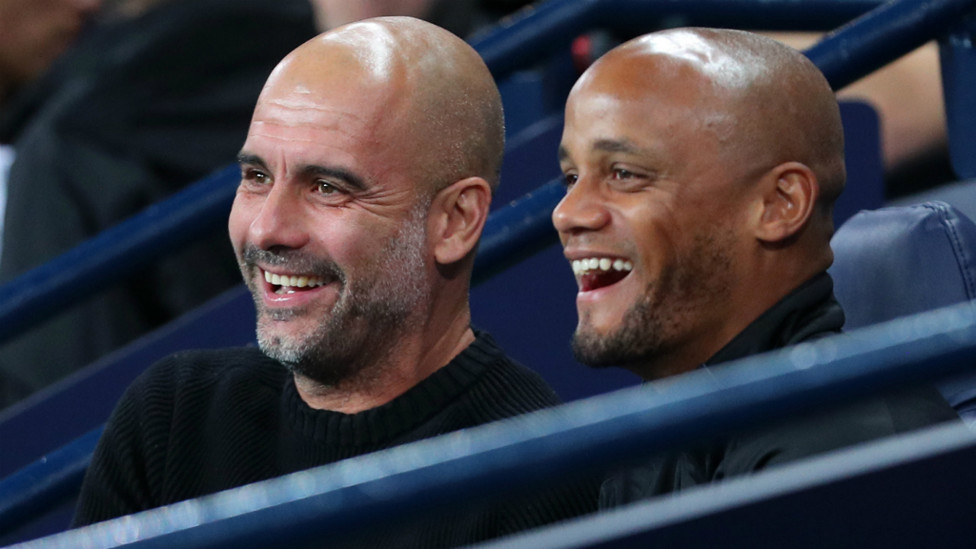 DOUBLE ACT : Pep Guardiola and Vincent Kompany are glad to see a late draw