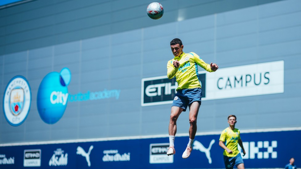 UP IN THE SKY  : Phil Foden springs up. 