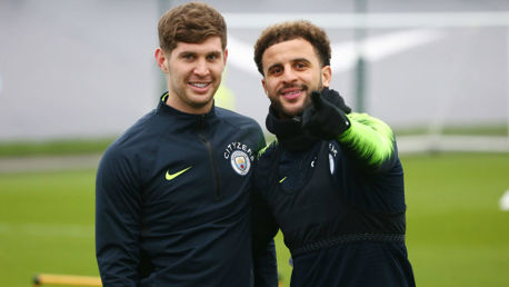 RUMBLED: Kyle Walker and John Stones notice the camera
