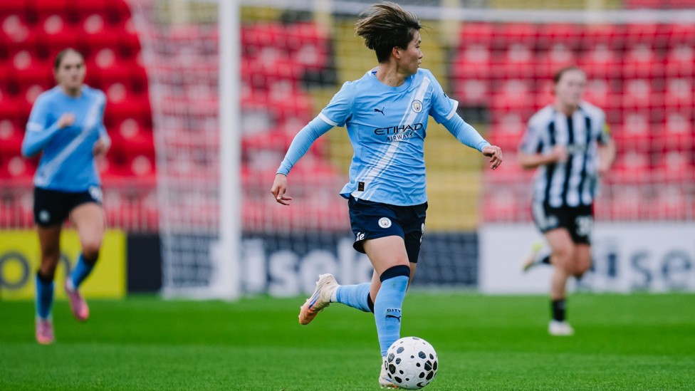 ON THE BALL: Aoba Fujino drives forward in possession