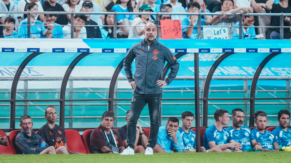 FROM THE DUGOUT : Pep Guardiola watches his side