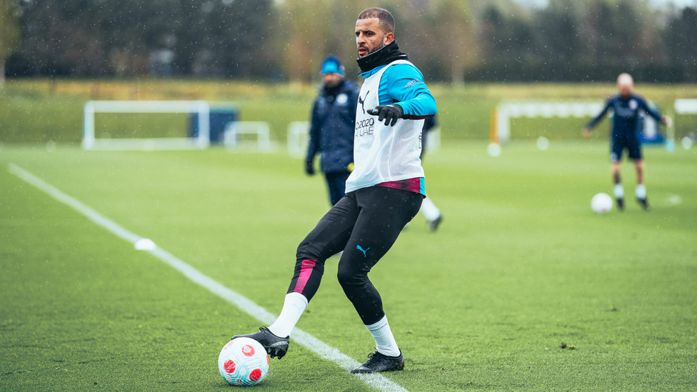 QUICK FEET : Kyle Walker lays the ball off