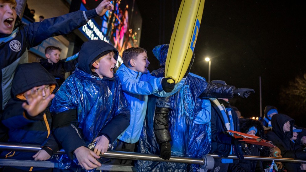 UP FOR IT : Fans gather outside ahead of kick-off