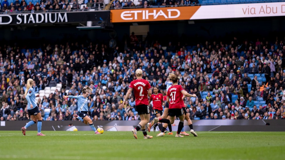 SUPER STRIKE: Lauren Hemp adds the third with a brilliant finish