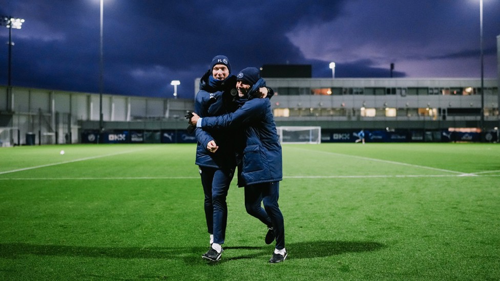 PEP SQUARED : Pep Lijnders and Pep Guardiola share a warm embrace during a chilly session. 