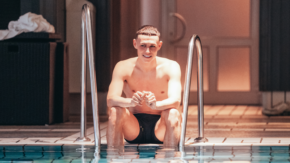 TESTING THE WATERS : Phil Foden dips his toes in the pool 