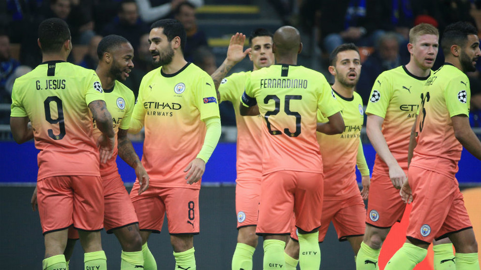 CELEBRATION TIME : The City players salute Raheem Sterling after his early opener