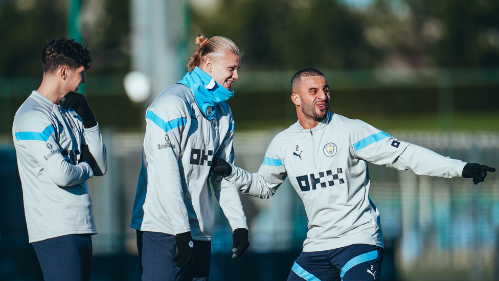 POIT OF ORDER: Kyle Walker shares a light-hearted moment with Erling Haaland and John Stones.