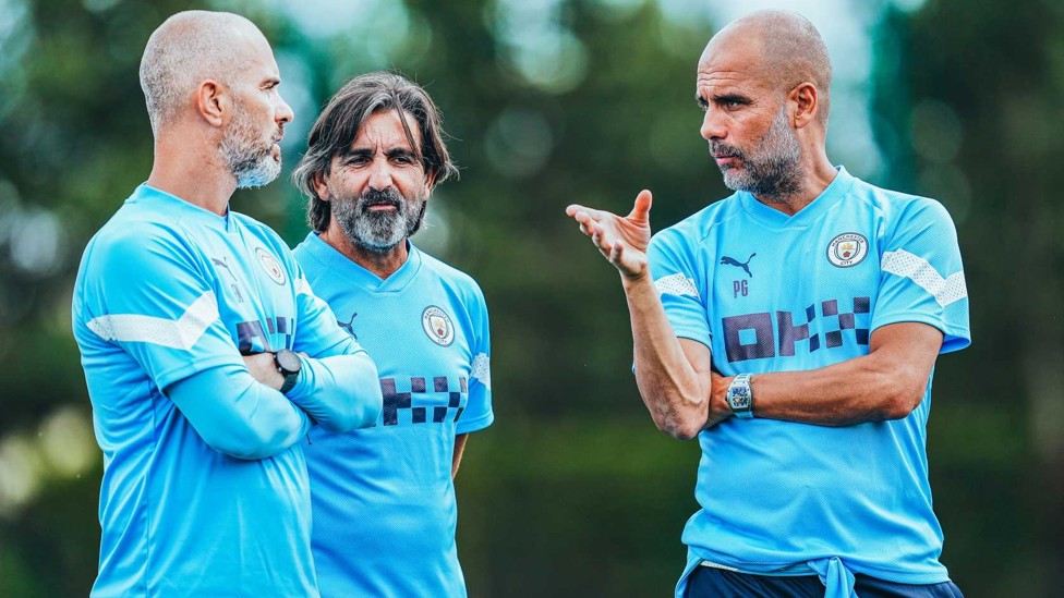 BACK AT THE CFA : Enzo chats to Pep Guardiola and fitness coach Lorenzo Buenaventura after returning to the Blues in the summer of 2022.