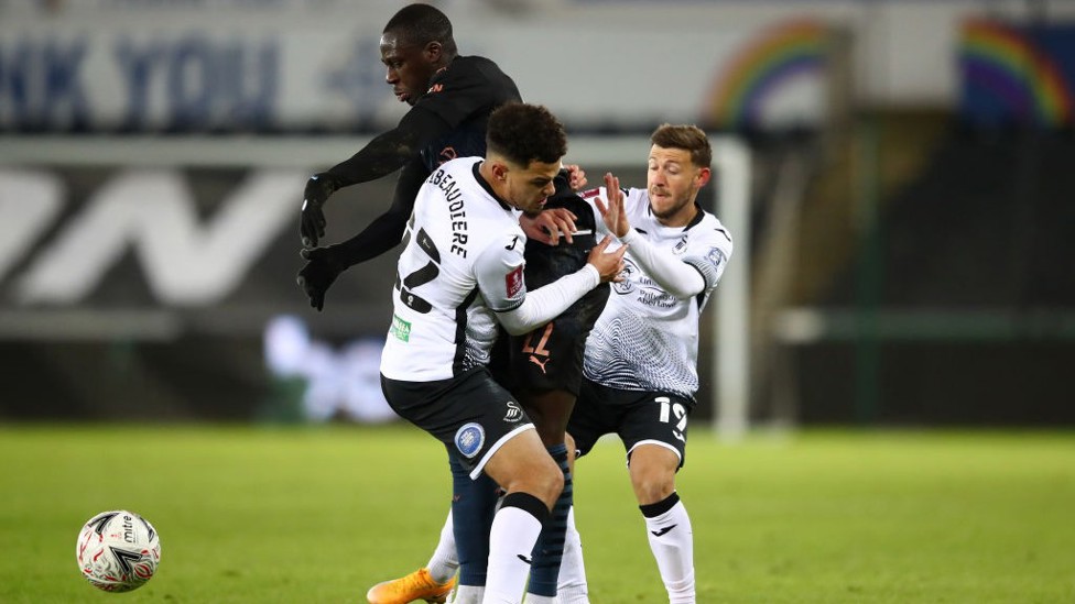 BATTLING BENJAMIN: Benjamin Mendy muscles his way to the ball