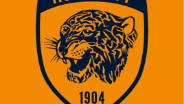 An orange and black logo featuring a tiger's head, the words 'HULL CITY' and the year '1904'.