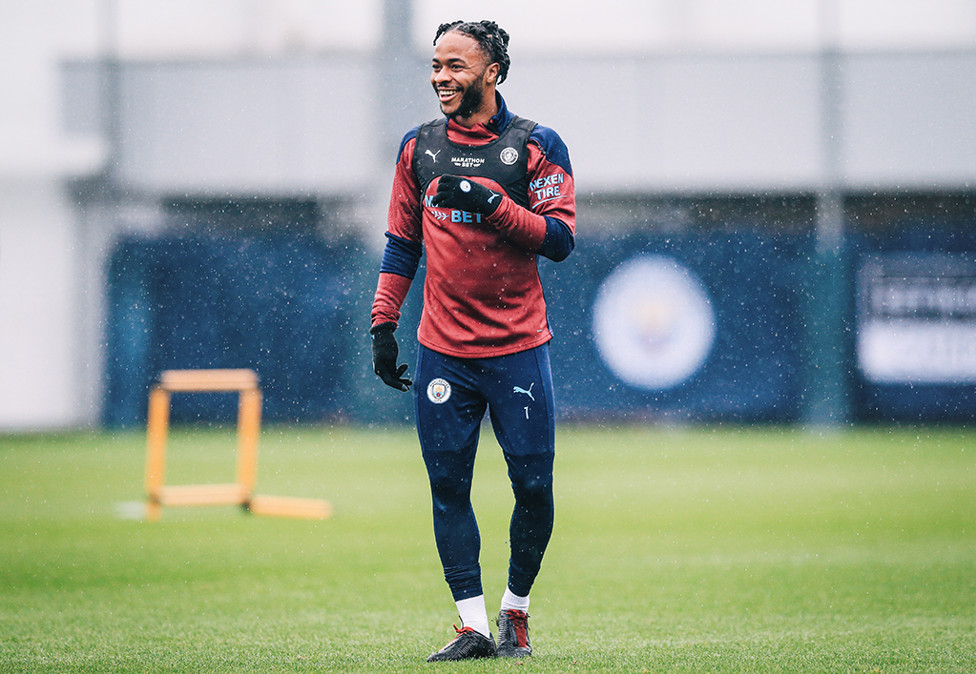 SHOWER POWER: Raheem was in buoyant mood... despite the liquid sunshine!