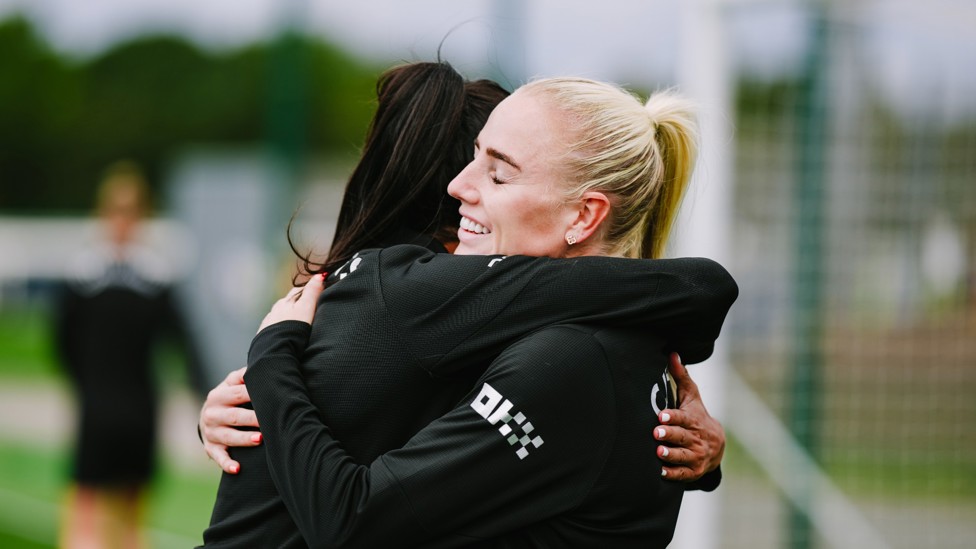 HUG IT OUT : Kerolin and Alex Greenwood embrace