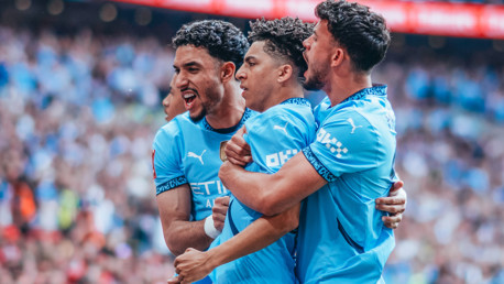 LOVELY LEWIS: Celebrates the goal.