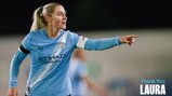 A Manchester City women's team player in action, wearing a blue jersey with Etihad Airways logo, pointing on the field. Text 'Thank You Laura' is displayed.