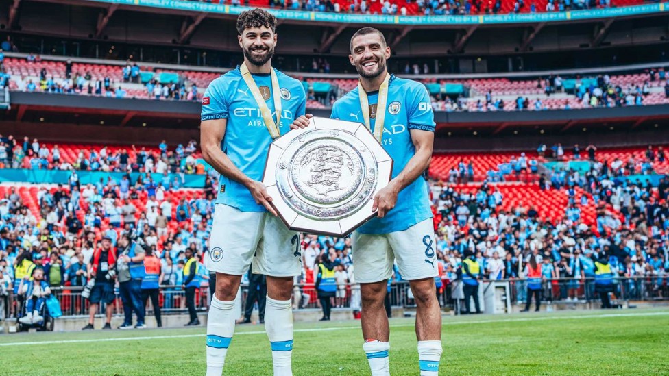 MORE JOY : It’s that pair again as they celebrate another trophy – this time the Community Shield ahead of the 2024/25 campaign.