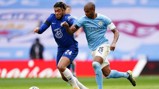 MY BALL: Fernandinho and Reece James battle for possession 