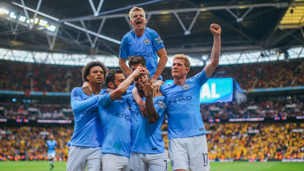 CAUSING A STER : The lads mob Raheem after one of his goals