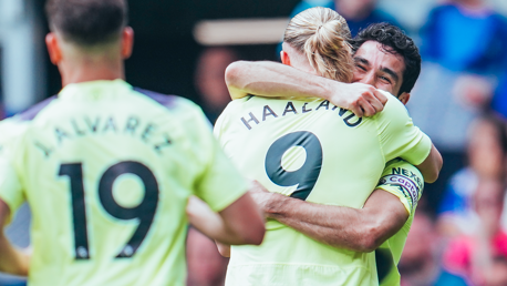 HAALAND HUG: Our number nine shares the love with the skipper after our second goal.