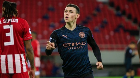 OPENER: Foden wheels away to celebrate after stroking City ahead in the 36th minute.