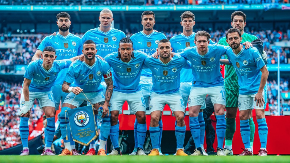 LET'S GO: The City team pose prior to kick-off.