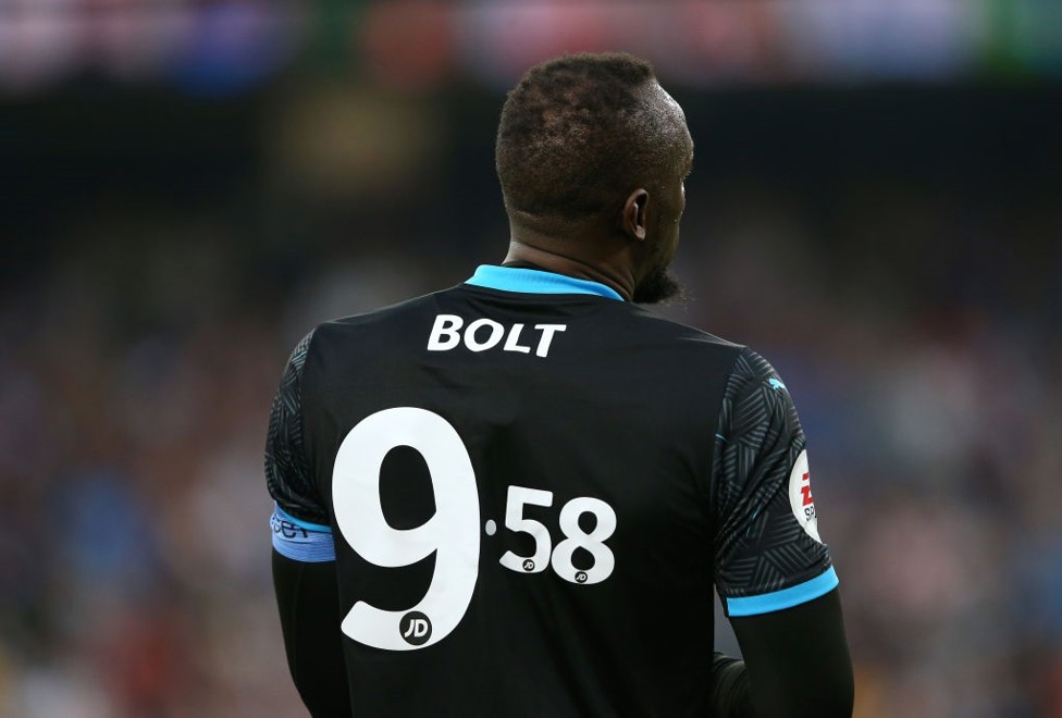 Usain Bolt with his world record shirt number