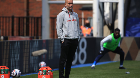 Pep Guardiola watches on from the dugout