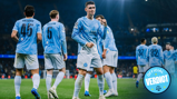 Players in Manchester City jerseys celebrating a goal on a soccer field during a match with a stadium crowd in the background.
