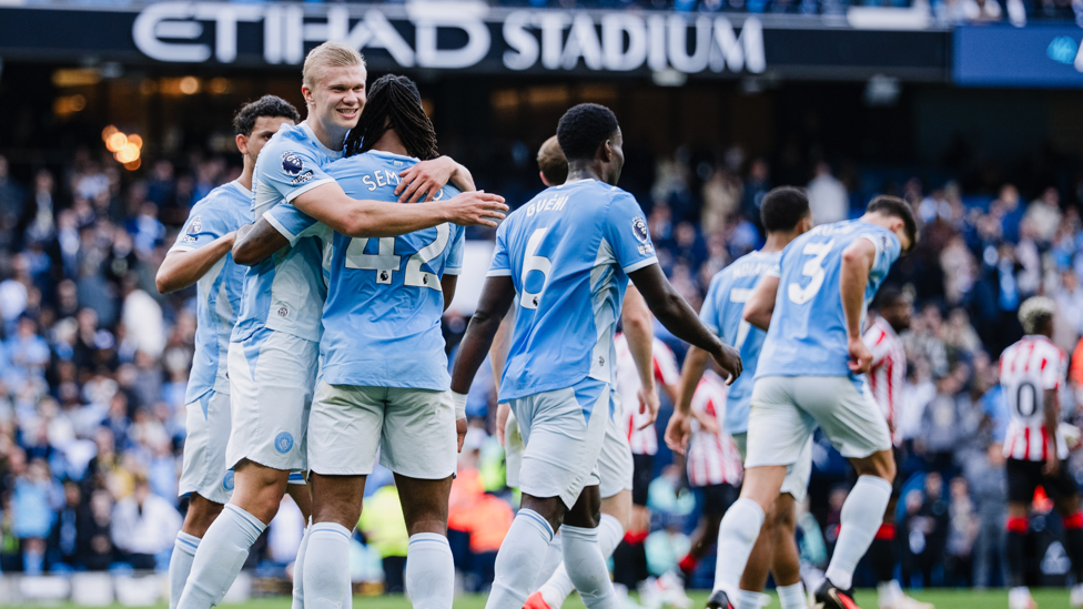 HAALAND HUG : Erling congratulates Semenyo.