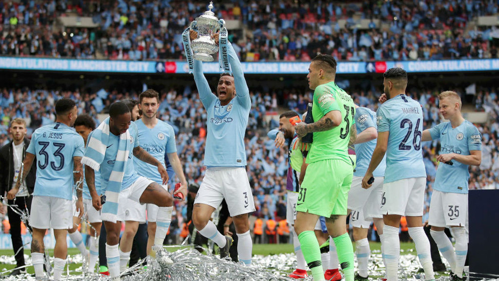 UP FOR THE CUP : The Brazilian lifts the FA Cup after our 6-0 win over Watford