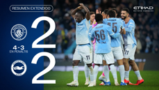 Image showing Manchester City players celebrating after a match against Brighton & Hove Albion. The score is tied 2-2, with Manchester City winning 4-3 in penalties.
