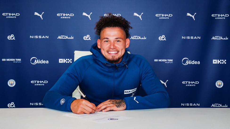 PEN TO PAPER : Phillips signs on the dotted line