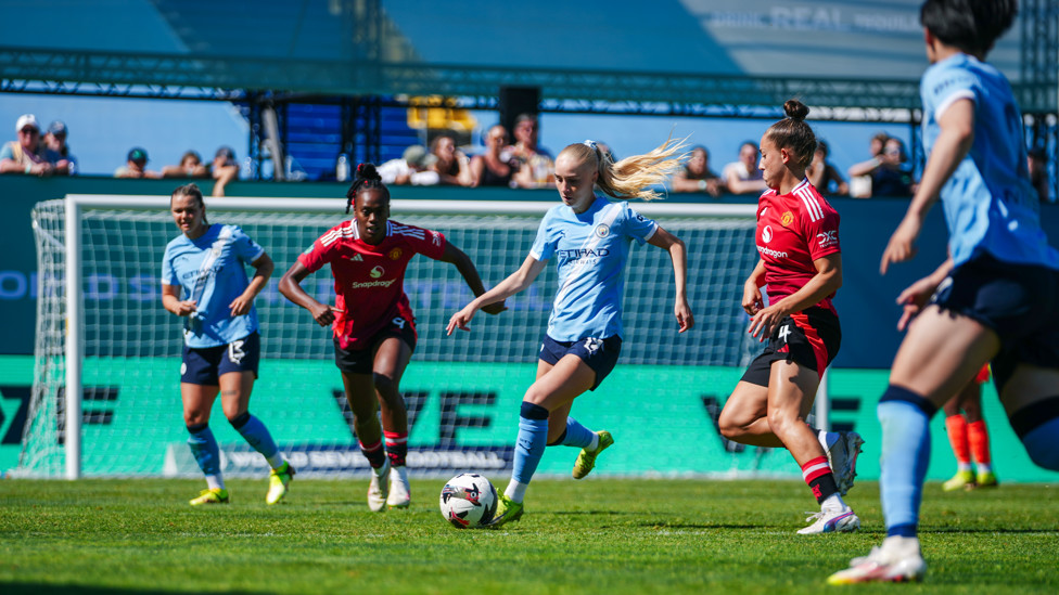 PASS AND MOVE  : Laura Blindkilde Brown looks to carve out an opening. 