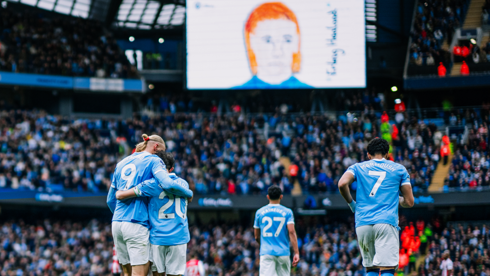 HAALAND HUG : Celebrating with the skipper.