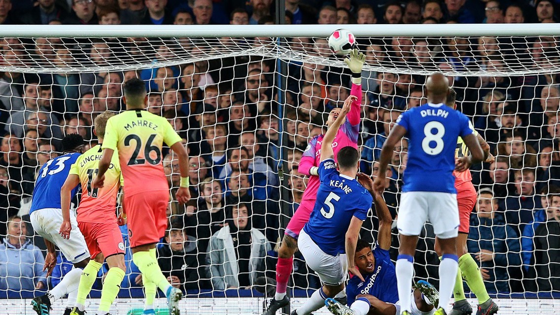 WONDER SAVE: Ederson pushes Mina's header over from point-blank range
