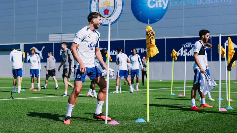 ALL SMILES : Rúben Dias in buoyant mood in training at the CFA.