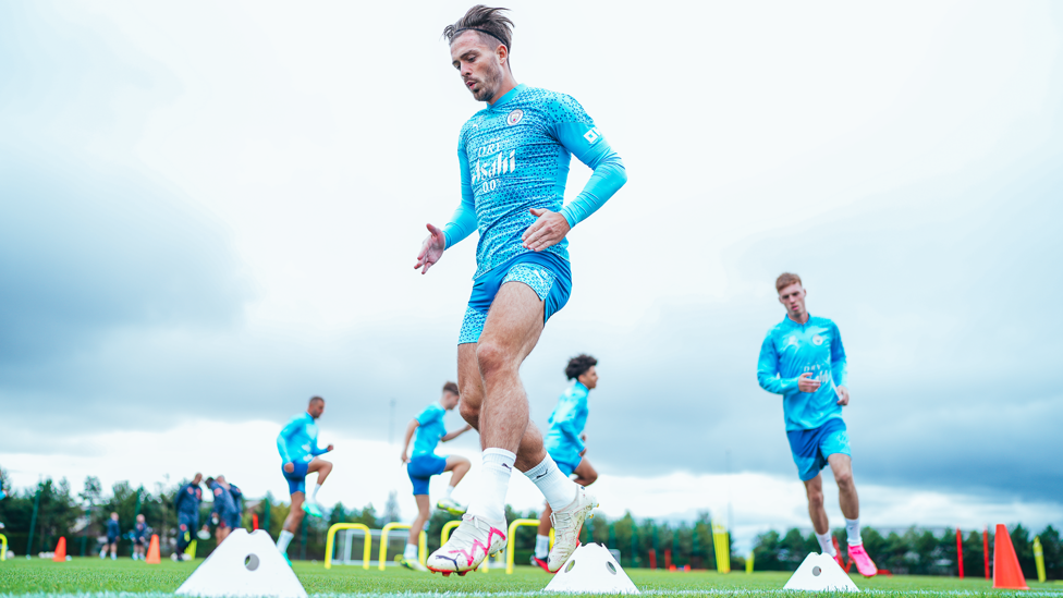 JUMPING JACK : Grealish slaloms through the cones.