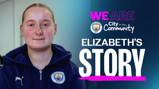 Blurred person wearing Manchester City hoodie in front of 'We Are City in the Community' text, promoting Elizabeth's Story.