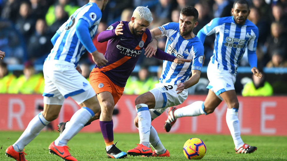 PERSISTENCE : Sergio muscles his way through the Terriers' defence
