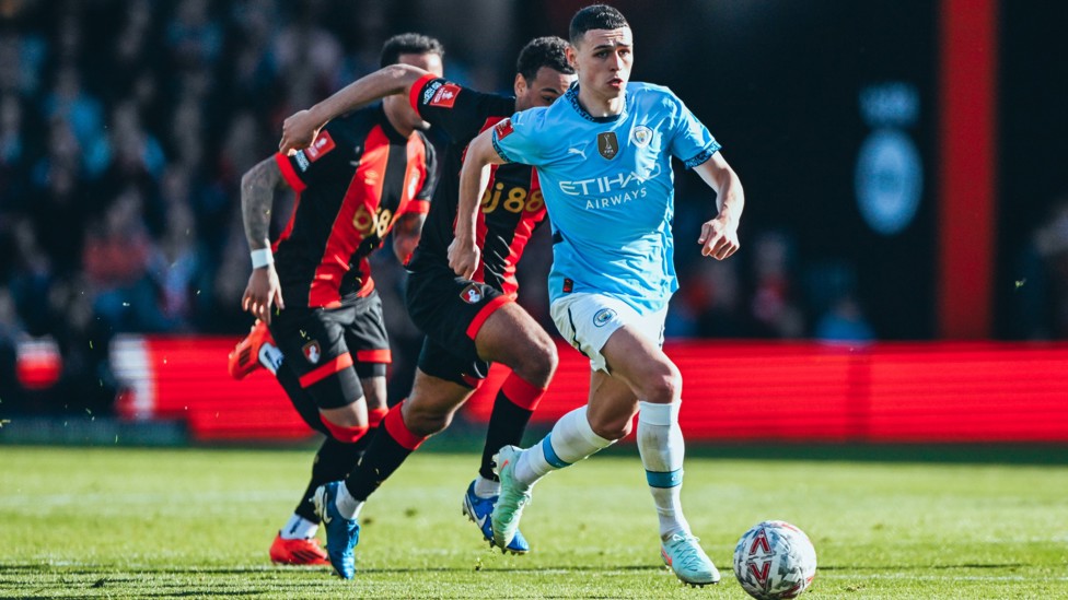 INTENSE BATTLE : Phil Foden looks to create an attacking spark.