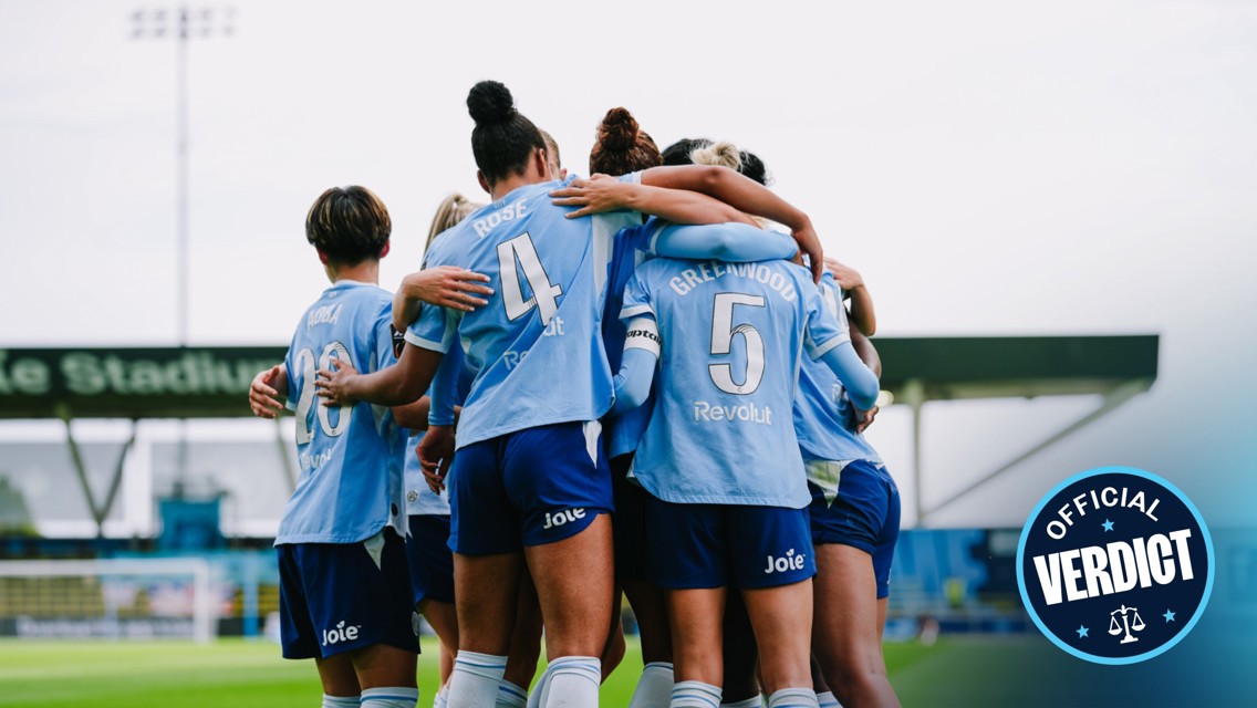 A group of female football players huddling in celebration wearing light blue jerseys numbered 4, 5, and 20. Text overlay reads 'Official Verdict.'