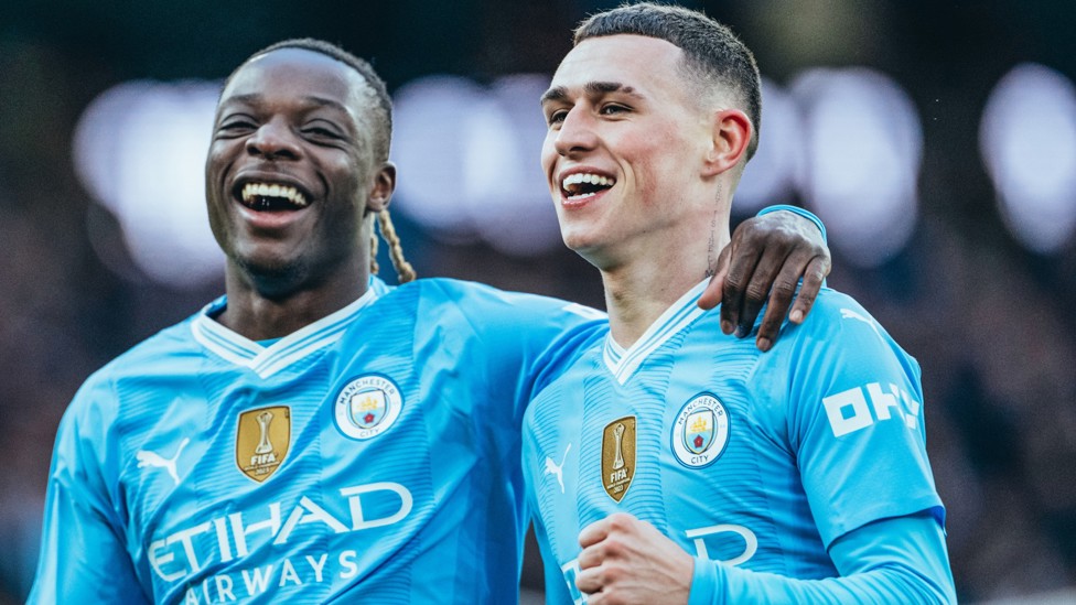 ALL SMILES : Doku celebrates after Foden makes it 4-0.