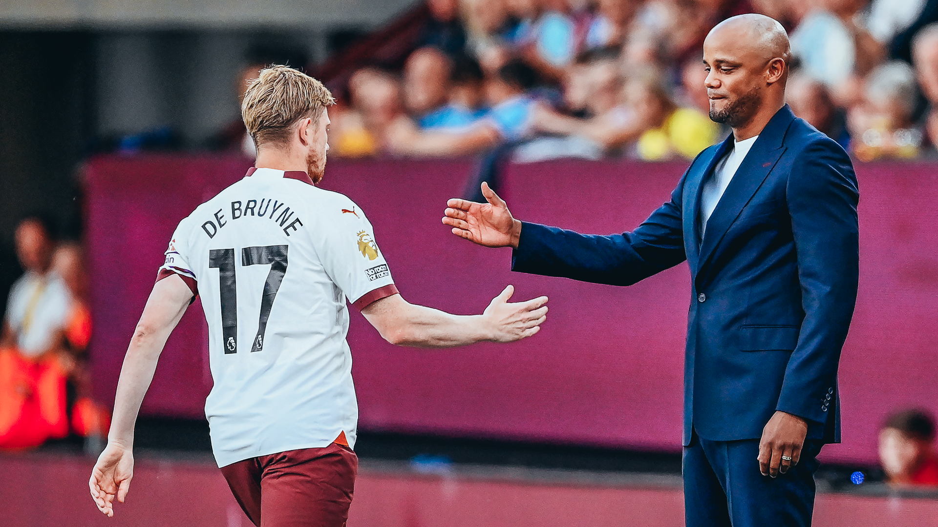 CONSOLING ARM: Vincent Kompany commiserates with De Bruyne as he makes his way off the pitch.